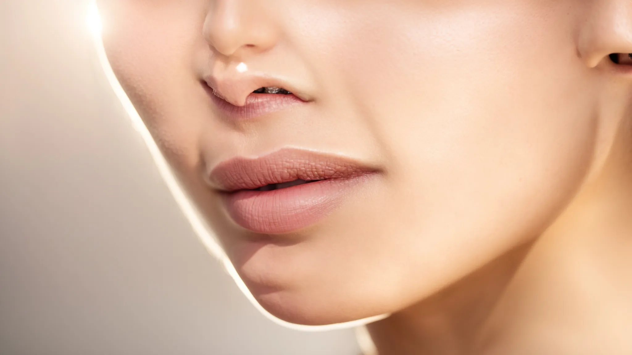 a serene and glowing close-up of a freshly treated chin, showcasing smooth, rejuvenated skin glistening under soft, diffused light, surrounded by gentle cleansers and soothing creams that signify effective aftercare strategies.